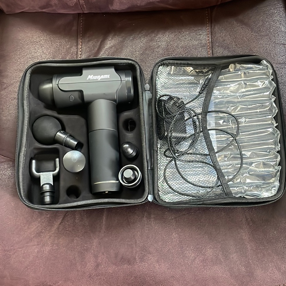Black massage gun for athletes for pain removal.